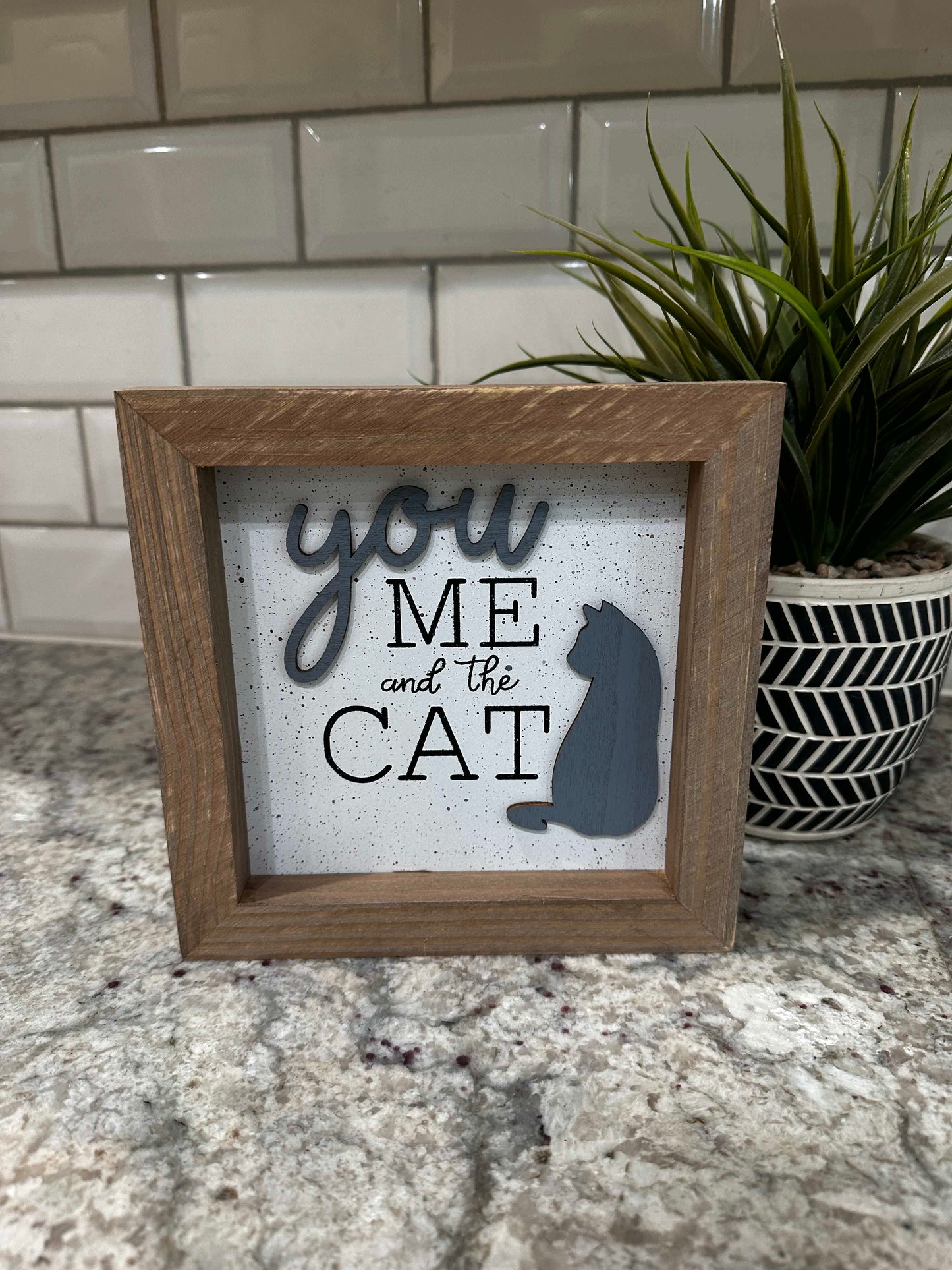 You me and the cat box sign